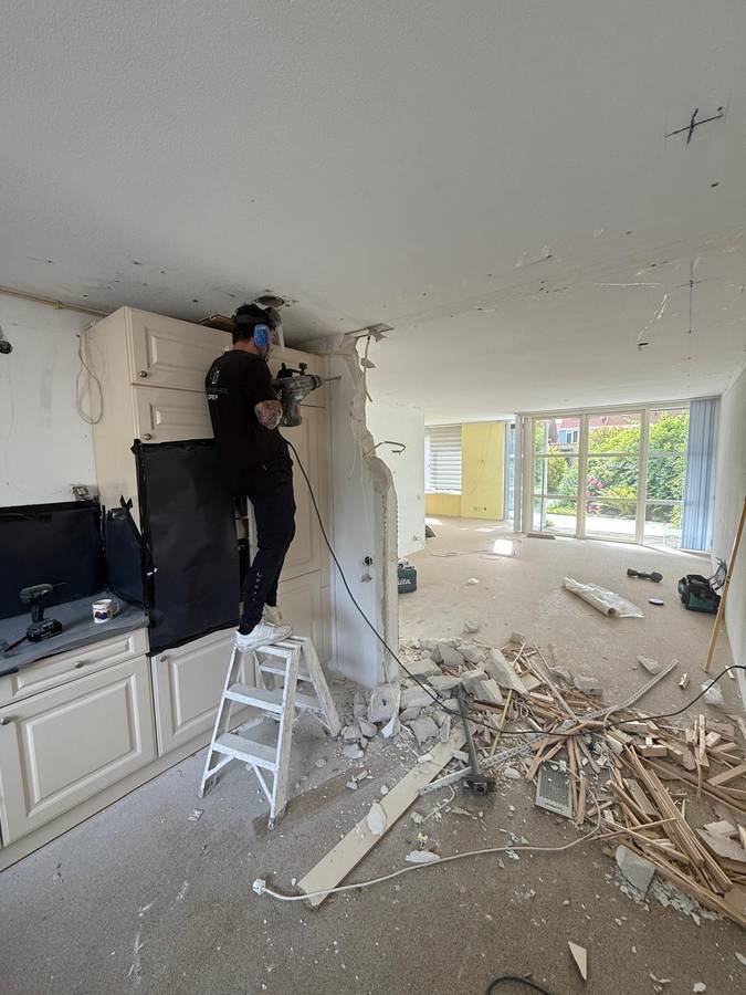 Muur doorbreken in woning
